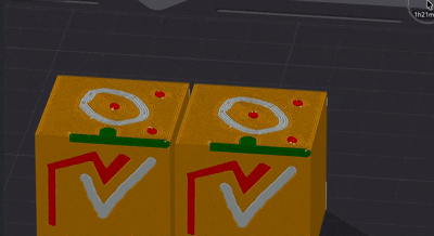 The same painted design projected straight into two test cubes, seen in preview
